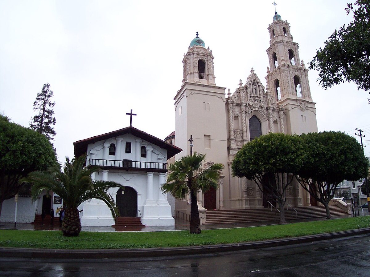 The historic adobe facade and bell tower of Mission Dolores in San Francisco