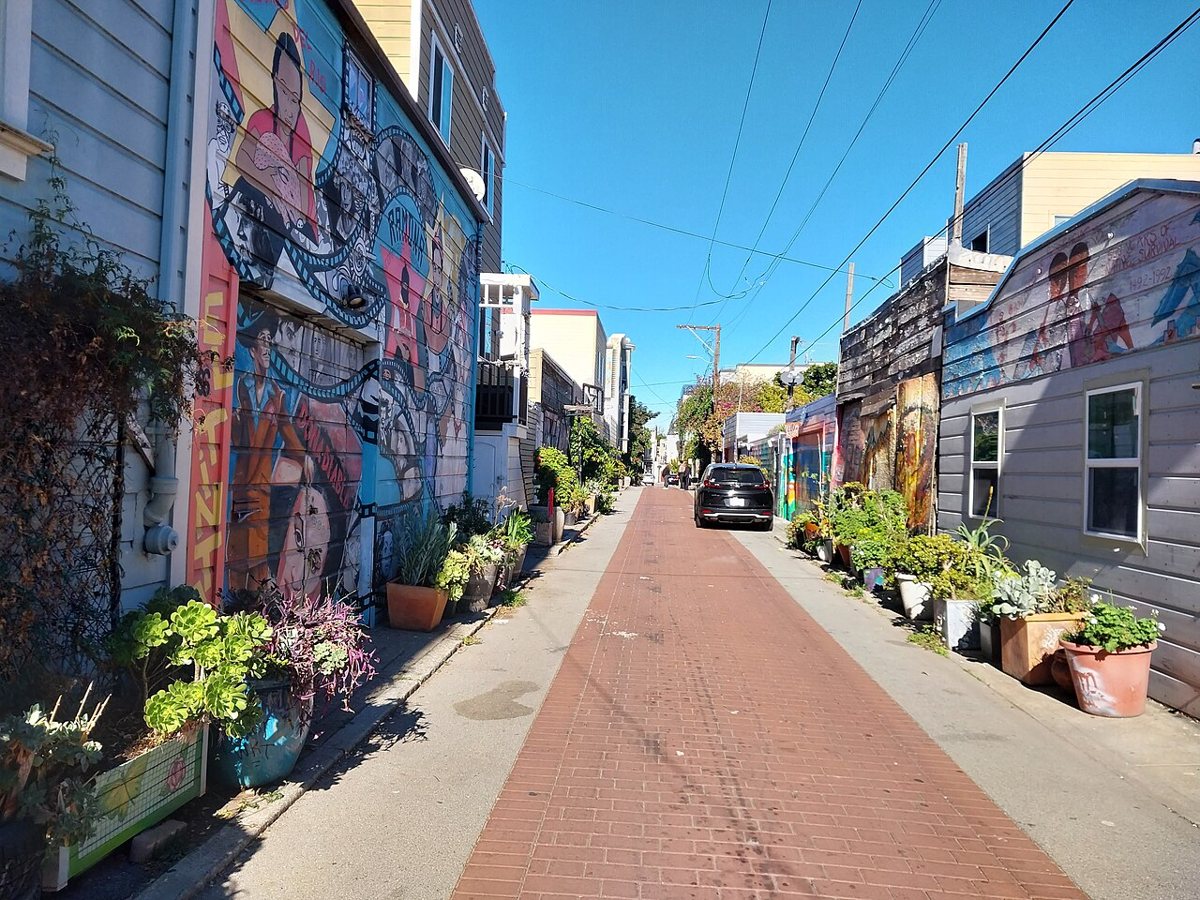Vivid Latino cultural murals lining the narrow walls of Balmy Alley in San Francisco's Mission District