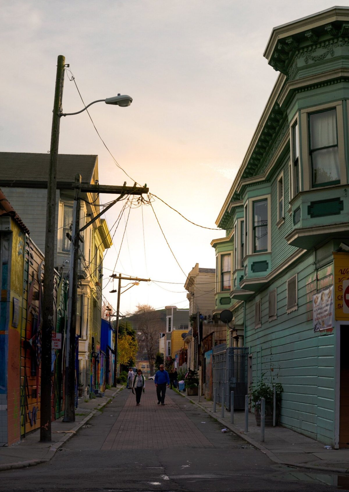 Rows of painted murals lining the garage doors of Balmy Alley